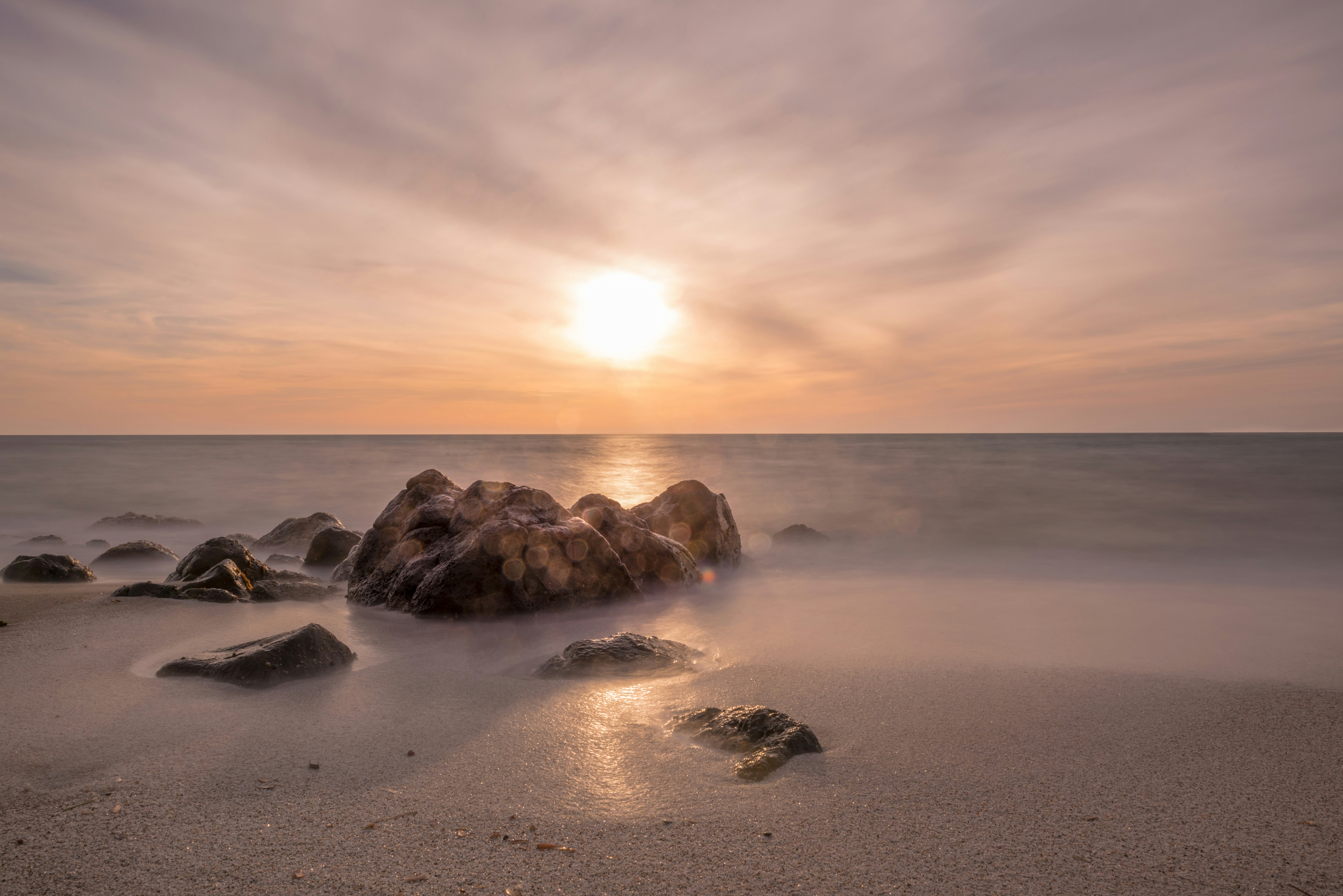 photo of rock in seashore